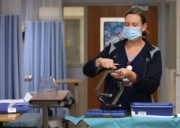 nurse using tools